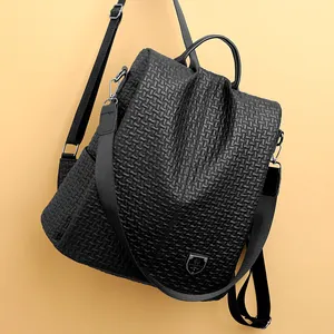 Fashionable black woven leather backpack for women with detachable nylon shoulder strap