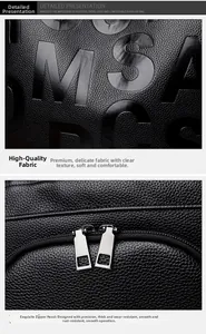Detail of lychee textured black leather bag with MSAC embossing and metal zipper pullers