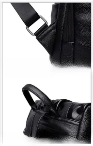 Detail of reinforced triangle straps and curved handle on black pebbled leather backpack