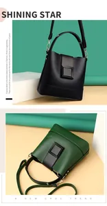 Detail view of stylish leather bucket bags with gold hardware and decorative square buckle