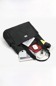 Internal layout of black nylon tote bag showing multiple compartments for iPad and umbrella