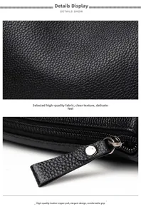 Close-up of black lychee grain leather texture and metallic zipper with leather puller