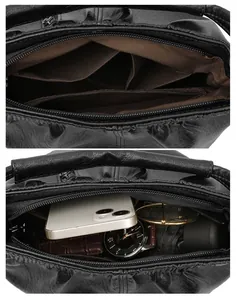 Detail view of the black leather handbag's interior pockets and spacious compartments
