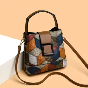 Chic multi-color patchwork bucket bag with lychee texture and adjustable strap