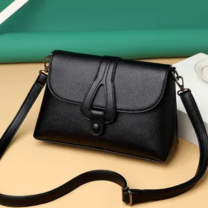 Sac bandoulière chic en cuir noir à motif litchi avec rabat et sangle réglable
