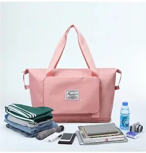 Borsa fitness rosa capiente con tessuto impermeabile e dettaglio dello strato espandibile