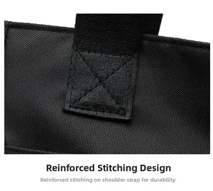 Macro detail of reinforced cross-stitching on the black fabric shoulder strap