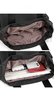 Detail view of large tote bag interior showing zip pocket and spacious compartments