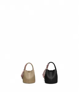 Detail of bucket bags with lychee grain leather and decorative geometric silk scarves