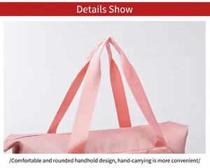 Dettaglio dei manici rinforzati in nylon rosa e trama in tessuto durevole della borsa