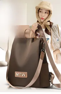 Brown Oxford fabric backpack with high-capacity design and adjustable woven straps