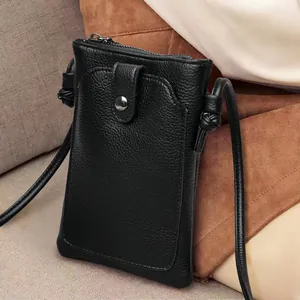 Mini sac bandoulière noir en cuir grainé pour téléphone avec bouton pression et nœud