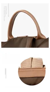 Close-up of durable Oxford fabric handbag handle with precision stitching details