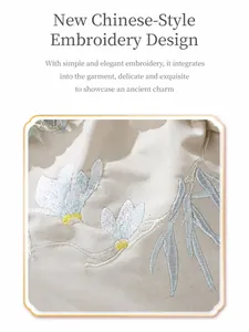 Close-up of elegant floral embroidery on beige fabric of a Chinese style handbag
