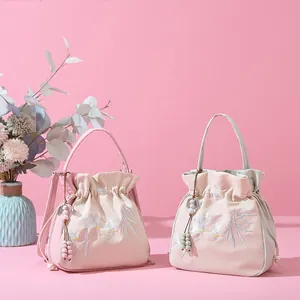 New Chinese style drawstring bucket bags with floral embroidery and tassel detail
