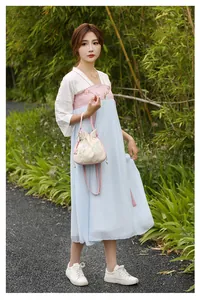 Exquisite floral embroidery detail on a traditional Chinese style drawstring handbag