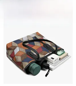 Top view of large capacity tote bag showing interior storage for umbrella and devices