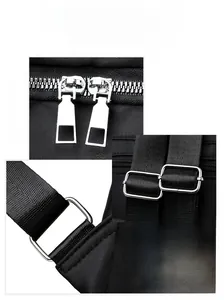 Detail of silver dual zippers and metallic hardware on black oxford fabric backpack