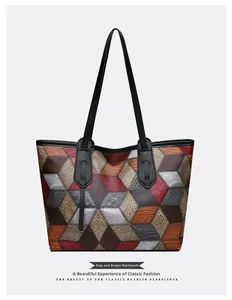 Detailed view of geometric patchwork pattern and lychee texture on large PU tote bag