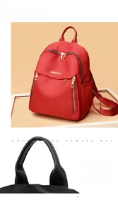 Detail view of water-resistant oxford fabric backpack with durable handle and gold zippers