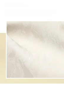 Detailed view of champagne pearlescent fabric with soft texture and elegant folds