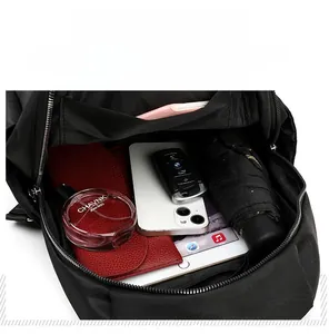 Internal view of a black large capacity nylon backpack showing multiple storage compartments