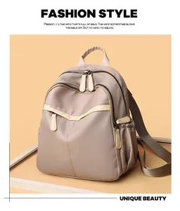 Front view of a purple nylon women's backpack with cream leather trim and multi-pockets