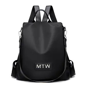 Versatile black oxford fabric backpack for women featuring top handle and MTW logo