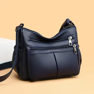 Μεγάλη σκούρα μπλε τσάντα χιαστί με ανάγλυφη υφή, πολλές τσέπες και φερμουάρ για γυναίκες