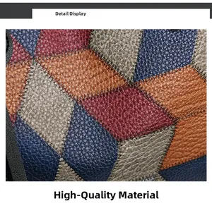 Macro view of multi-color patchwork PU leather with lychee grain and contrast stitching