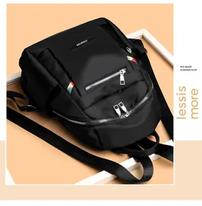 Close-up of black Oxford backpack with multi-layer metal zippers and rainbow webbing detail