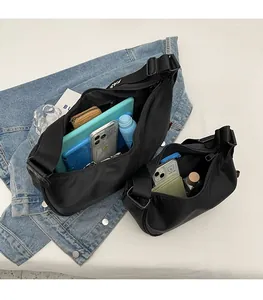 Interior view showing large capacity of black nylon crossbody bags for daily essentials