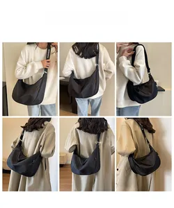 Detailed views of a black nylon crescent crossbody bag with printed fashion strap
