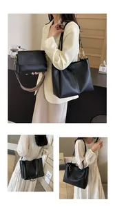 Detail of black tote set with wide printed shoulder strap and smooth PU leather finish
