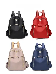 Oxford fabric backpack in black, red, khaki, and blue showing multiple color options
