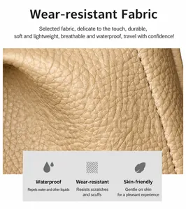 Close-up of beige lychee grain leather texture with white stitching and waterproof finish