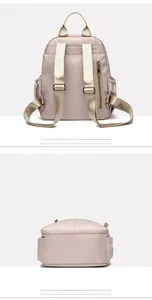 Detailed back view of khaki nylon backpack showing anti-theft zipper and adjustable straps