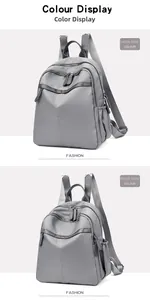 Comparison of grey nylon backpack in large and small sizes with dual zippers