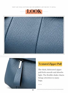 Makroansicht von blauem Leder mit Litschi-Maserung und hochwertigem Silber-Reißverschluss