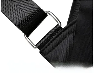 Close-up of reinforced stitching and polished silver metal buckle on black nylon strap