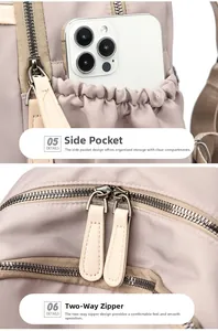 Detail view of side pocket with elastic closure and dual metal zippers on pink nylon backpack