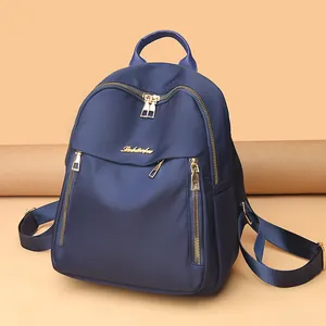 Fashionable navy blue oxford cloth backpack for women with large capacity and gold zippers