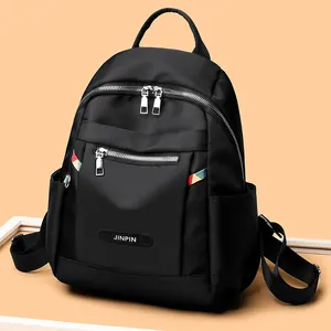 Black Oxford fabric backpack for women with colorful woven straps and multi-zipper pockets