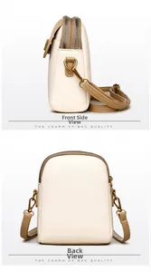 Détails du petit sac bandoulière en cuir grainé crème et camel avec zips dorés
