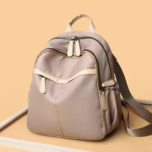 Elegant beige nylon backpack for women with multi-layer zipper compartments and top handle