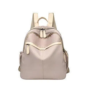 Taupe waterproof nylon backpack for women with multiple zip pockets for travel and commute
