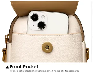 Détail de la poche avant d'un sac de téléphone en cuir montrant le rangement du mobile