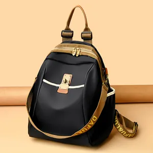 Fashionable black nylon backpack with brown straps and vintage metal buckles for women