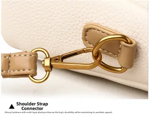 Détail du crochet en métal doré multicouche et du connecteur de sangle en cuir