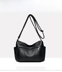 Front view of black soft PU leather shoulder bag featuring multi-pocket litchi texture